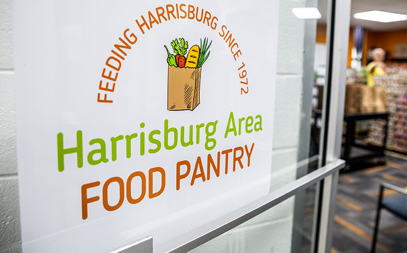 Sign for the Harrisburg Area Food Pantry on a building entrance
